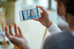 A video consultation between a GP and a patient. AdobeStock_335825341 from Adobe stock photos from https://stock.adobe.com/uk/