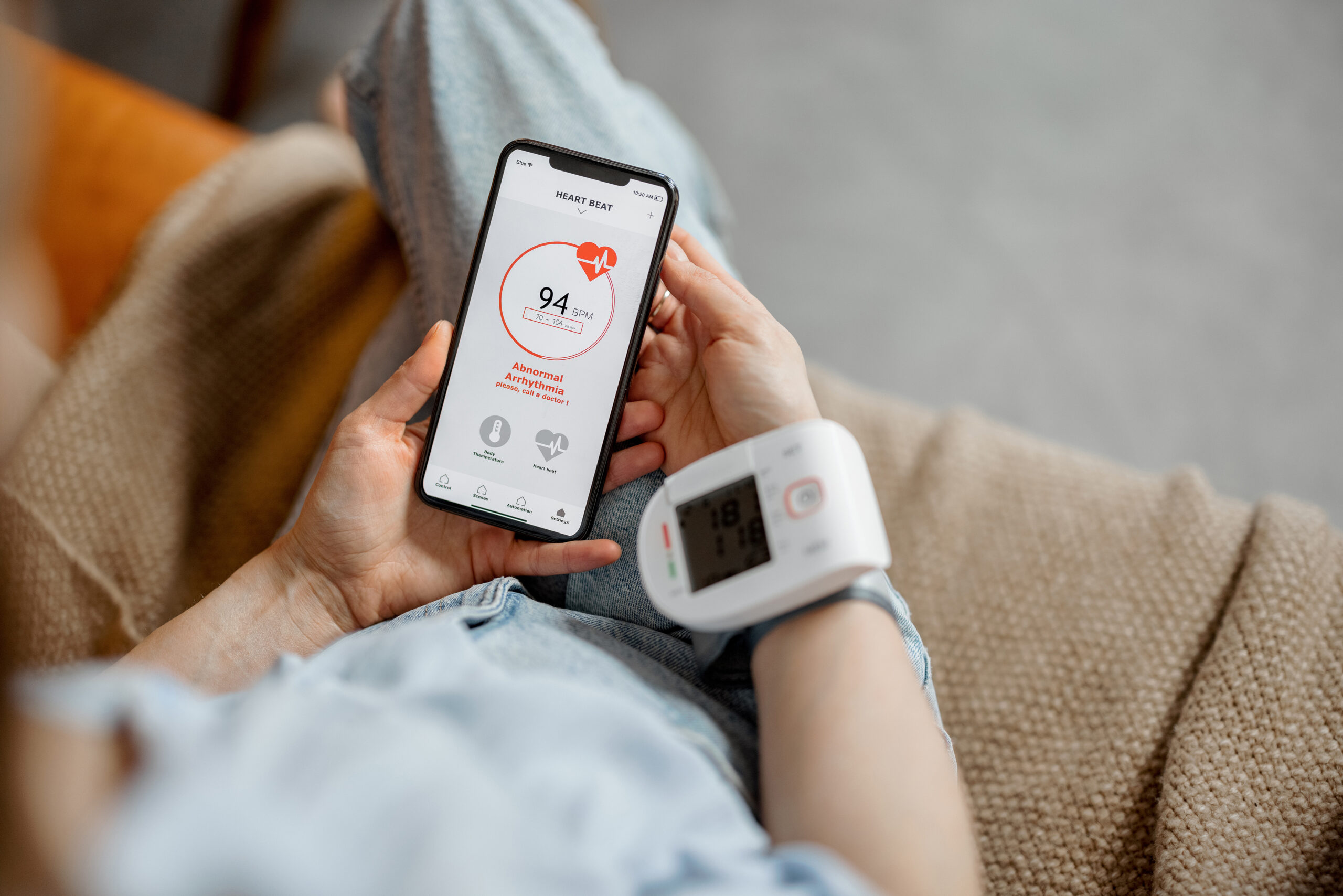 A patient checking their heart beat via a smart phone. AdobeStock_415359005 from Adobe stock photos from https://stock.adobe.com/uk/