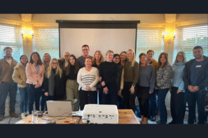 Image of participants from Leading Teams Through Change Programme stood in row