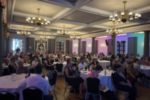 Image of delegates in a room at the Peer Ambassador event